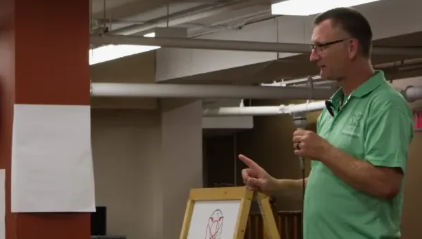 Darrell giving a presentation at a seniors safe event.